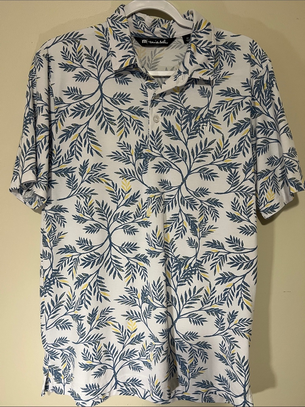 Travis Mathew White Polo with Blue and Yellow Leaf Print